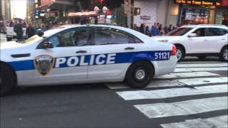 NY & NJ PORT AUTHORITY CRUISER ESCORTING 2 BLACK SUV'S ON W. 42ND ST. IN TIMES SQUARE, MANHATTAN.