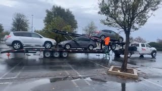 Transporting Repo cars, using 12k Badland winch in the rain.