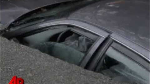 Raw Video: Sinkhole in Ga. Swallows Car