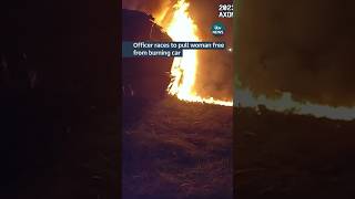 Officer races to pull woman free from burning car #itvnews #usa #police