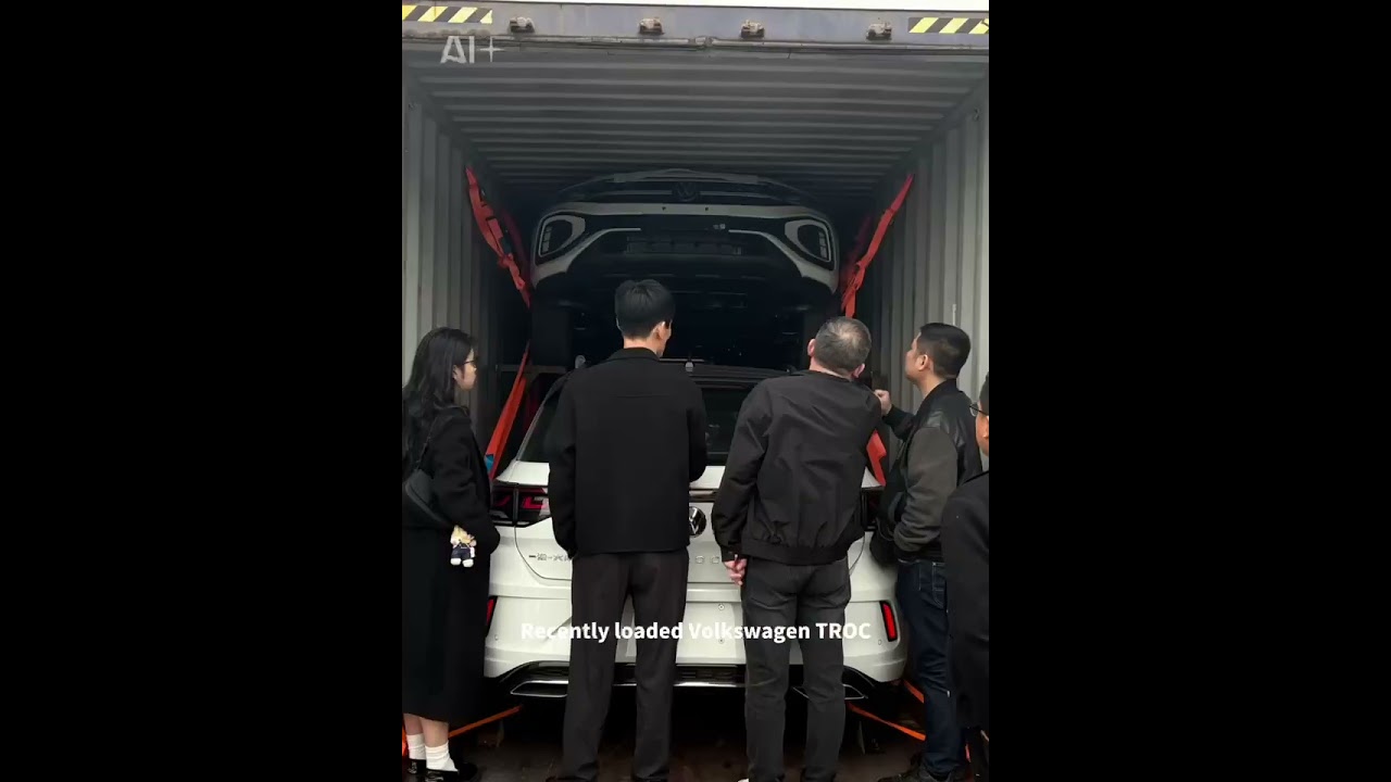 Large quantities of cars are being loaded into containers for export