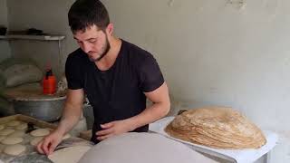 Ahmad shows us how he prepares Lebanese Saj Bread يبين لنا أحمد كيف يحضر خبز الصاج اللبناني