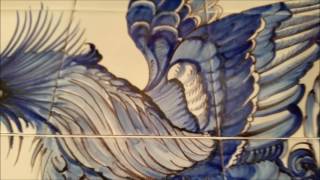 blue rooster painted on old Dutch tiles