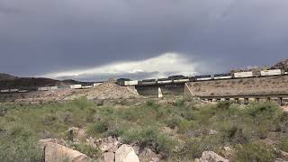 EBD BNSF stack climbs grade in Kingman Canyon over Santa Fe painted bridge 9/3/25