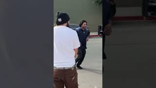 Random pedestrian leaves car and does kickflip 5050
