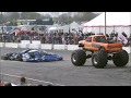 Monster trucks jumping over cars