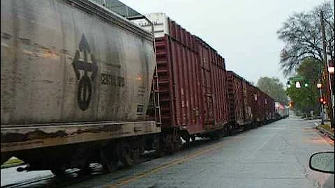 Augusta Rainy Day Street Running Action- BNSF 5180 leads NS 191 down 6th Street