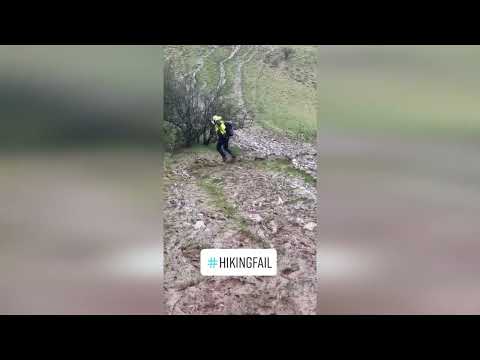 Hilarious video shows hillwalker somehow managing to stay on his feet on slippery hill