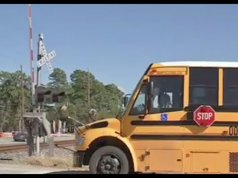WATCH: Train Narrowly Misses School Bus
