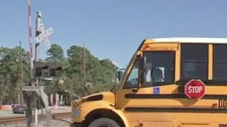 WATCH: Train Narrowly Misses School Bus