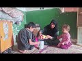 A nomadic woman in a village making paper.