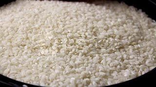 Arborio Rice Being Handled. Stock Footage
