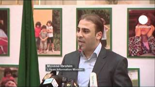 Defiance from Gaddafi regime as rebels close in