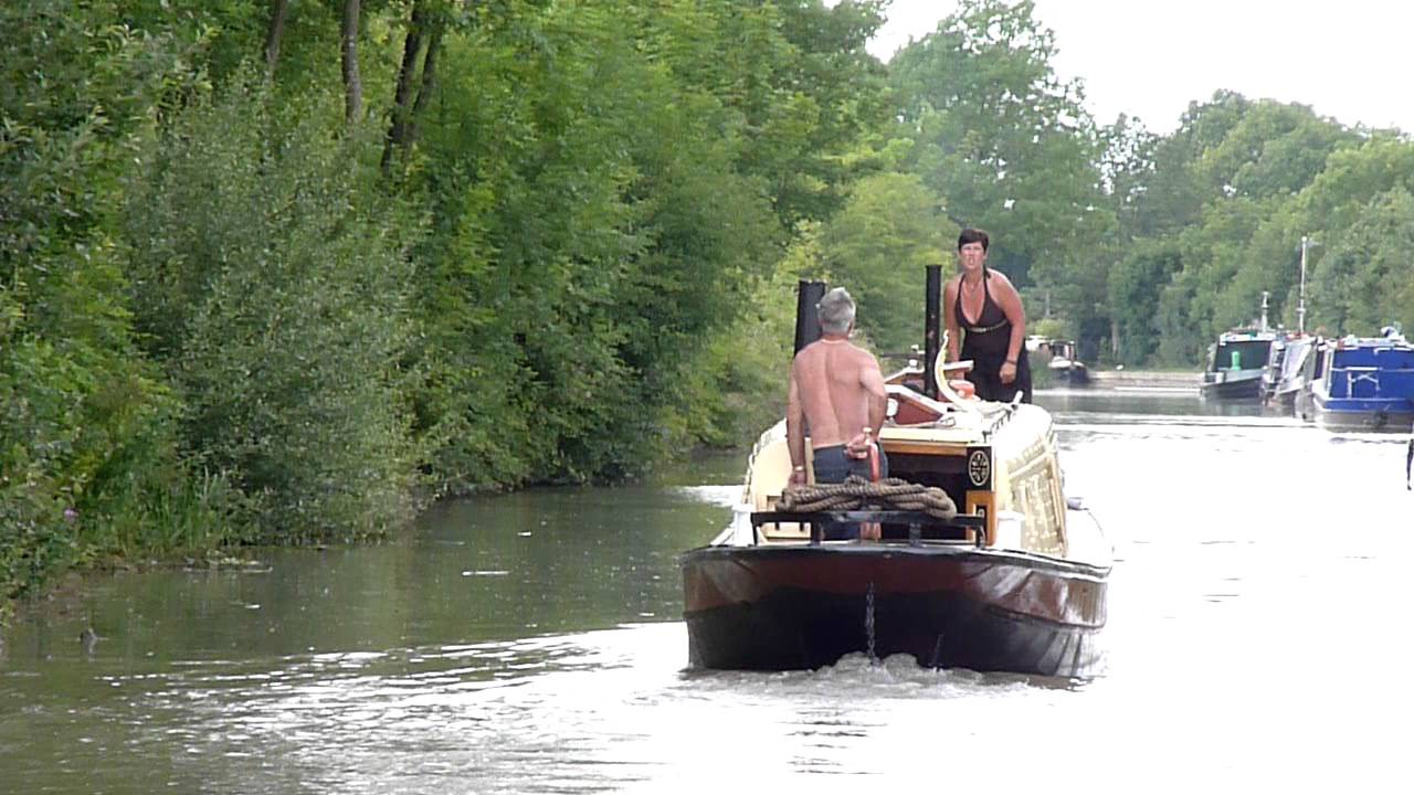 Sharpness narrowboat and arguing couple