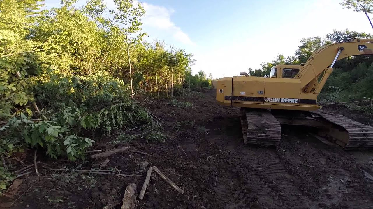 Clearing the land - Boy, it's wet out here!