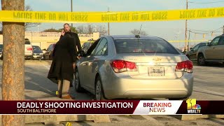 Woman found shot in car outside office building