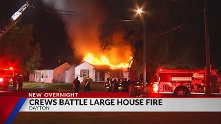Crews battle vacant house fire in Dayton
