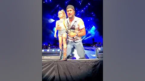 Darci Claire singing with Luke Bryan