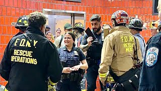 {COPS & CIVILIANS RESCUED }~{FDNY BOX 7233}~{FDNY OPERATING TO RESCUE 8 PERSONS STUCK IN A ELEVATOR}