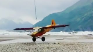 Helicopter lifting an Aeroplane