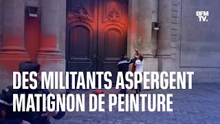Des militants écologistes aspergent Matignon de peinture orange
