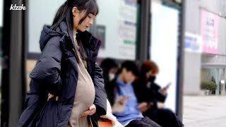 a pregnant woman who can't sit down