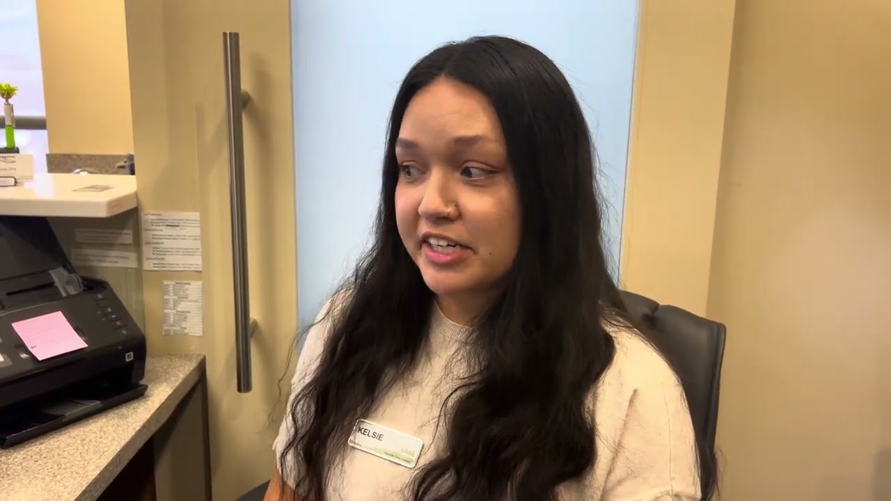 A front desk team member talking about InstantVerify in her office