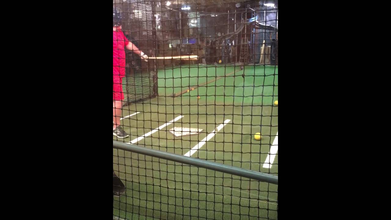Batting Cage in Louisville Slugger Factory me hitting with David