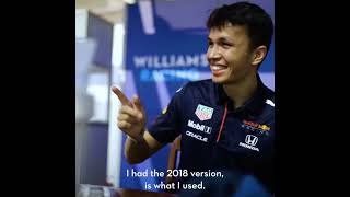 George Russell gives Alex Albon a PowerPoint book for dummies...
