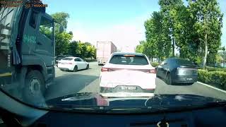 A car stopped on the road, signalled left, and collided with another vehicle while changing lanes.