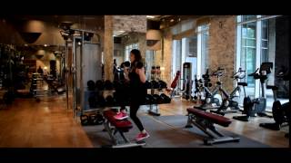 Exercise Library -  Dumbbell step up to overhead press