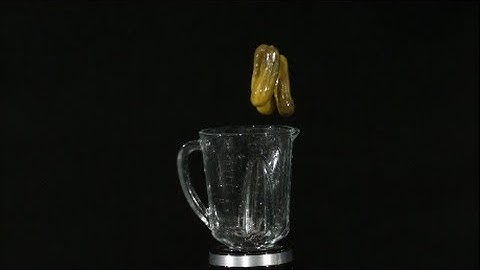 Blending Pickles Slow Motion into a Blender in High Definition HD Slow Mo Video Camera Action Shot