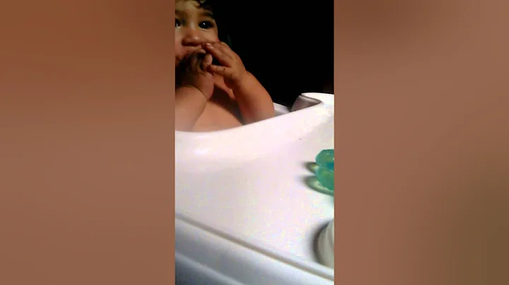 Baby eating a Oreo