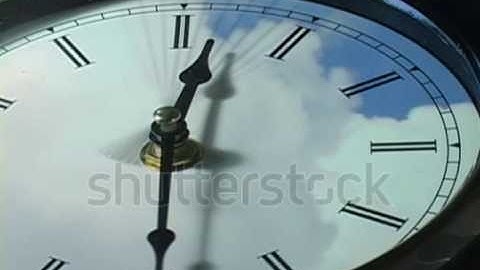 stock footage fast moving clouds over clock in time lapse loop