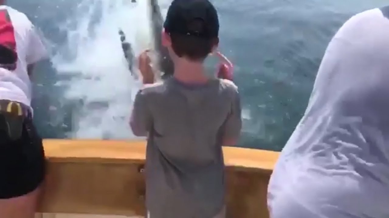 newspaper mockup Great white shark leaps from water to snatch fish off line