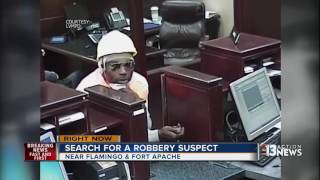 Police search for robbery suspect in a hard hat
