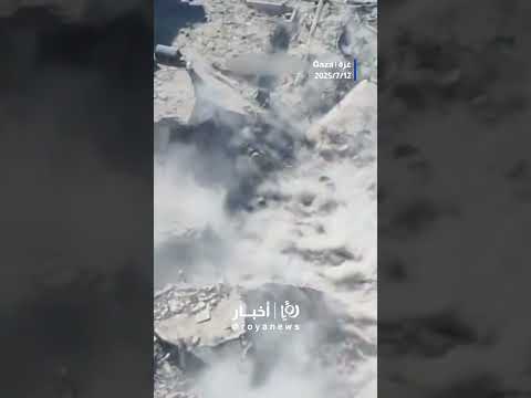 Palestinian Emerges From Rubble Hurls Explosive At Merkava