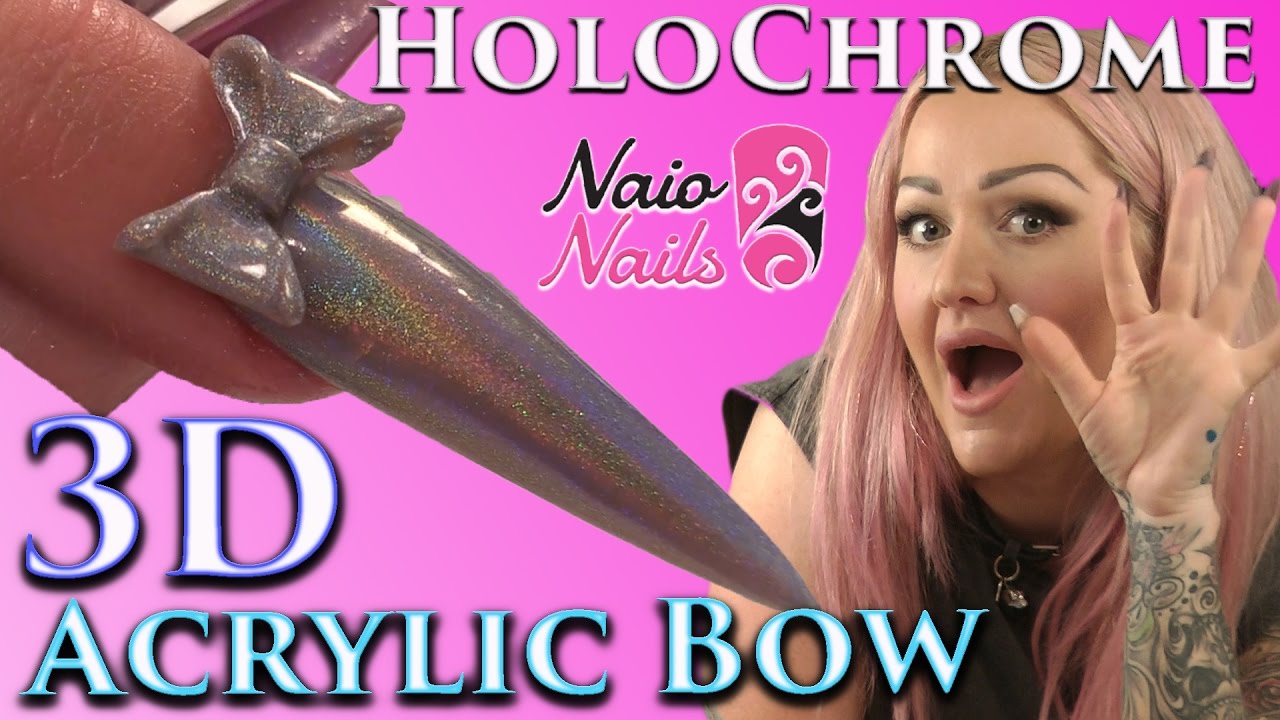 Holographic Chrome Acrylic Bow on a Stiletto Nail.
