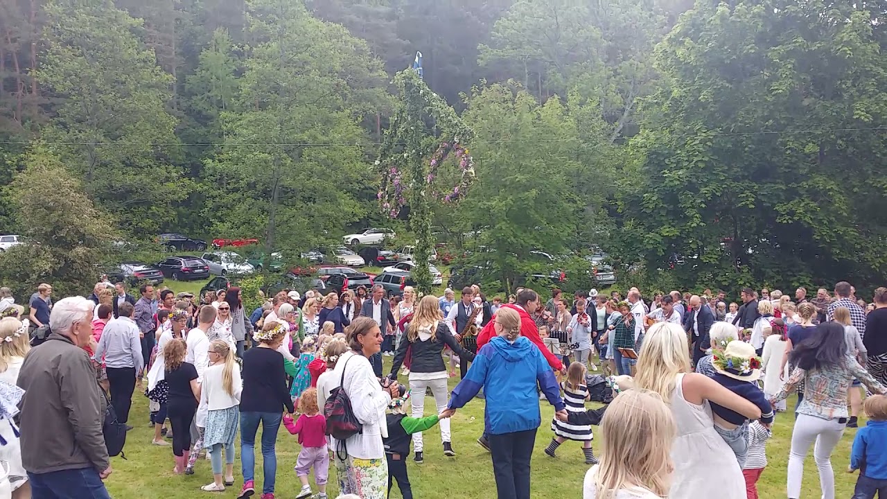 Swedish Midsummer dancing around Maypole