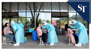 How is China conducting Covid-19 tests far greater than other countries
