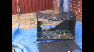 Smashing a wooden cabinet with glass doors. You can find his channel here: http://www.youtube.com/user/posmen0e.