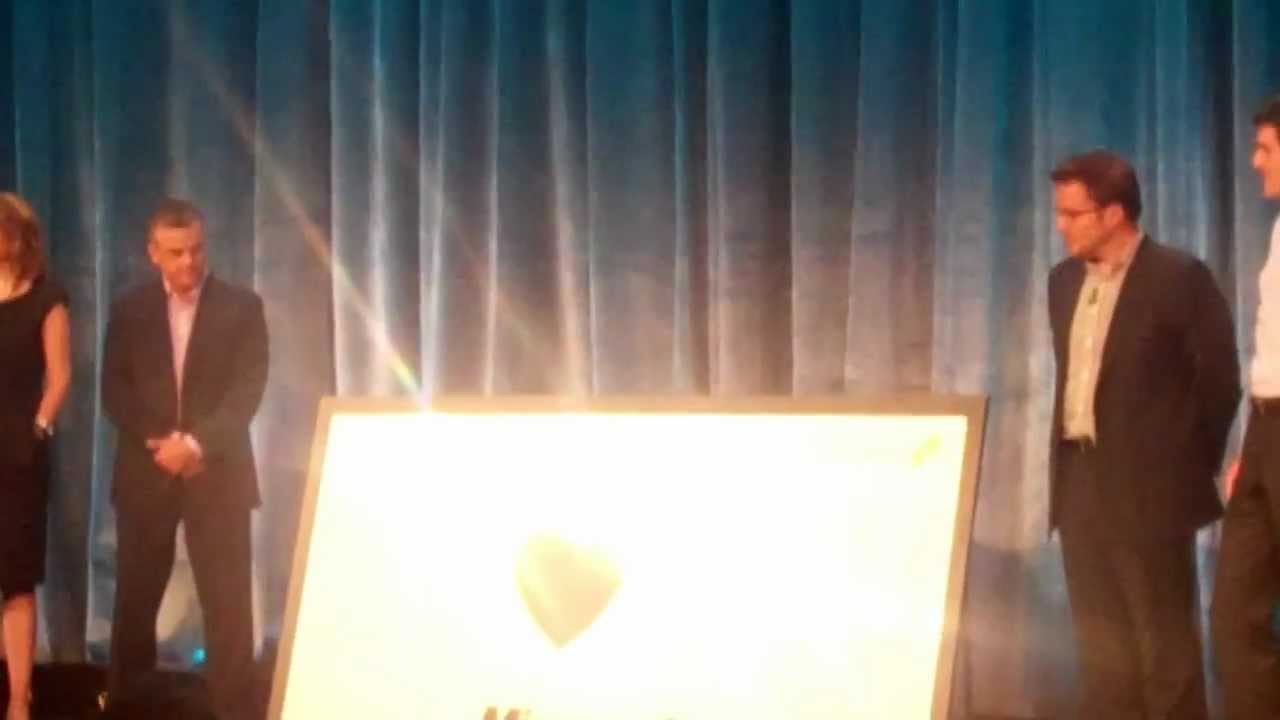 Navantis Team Presenting Microsoft Canada with Poster Signed by 380+ Navantis Employees