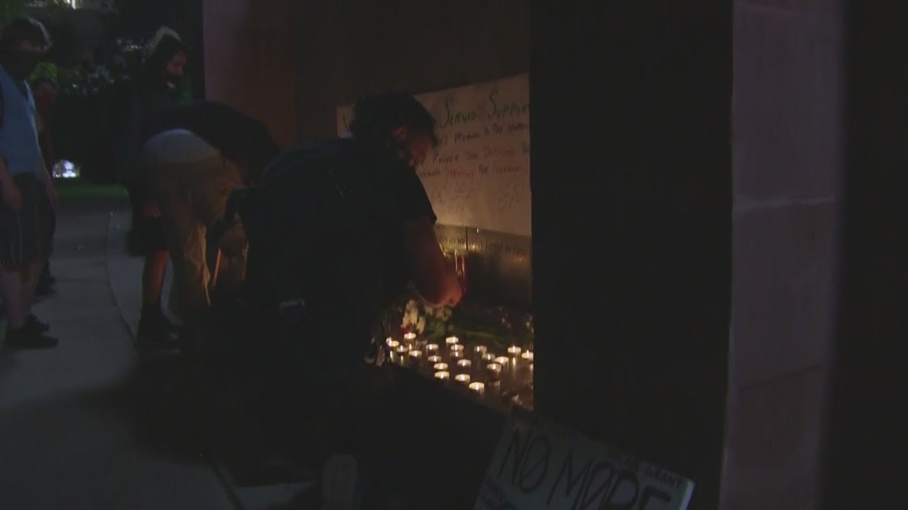 Dozens Of Candles Lit Along Colorado Heroes Memorial