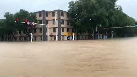 Intersection Completely Submerged as Flooding Continues in Anyang, China