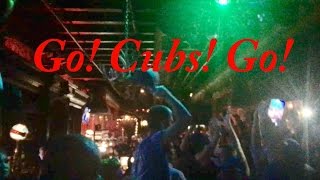 Fans sing Go! Cubs! Go! after winning the World Series in a Los Angeles bar