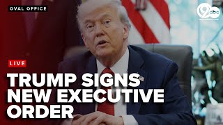 President Donald Trump signs a new executive order from the oval office