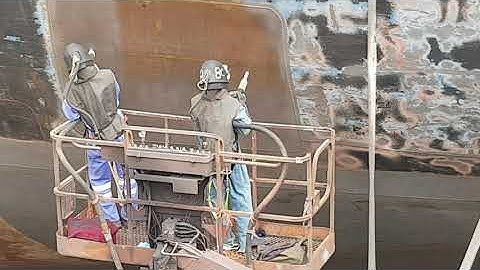 Container Ship Sand-Blasting at Dry Dock.