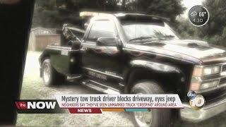 Mystery tow truck driver blocks driveway, eyes jeep