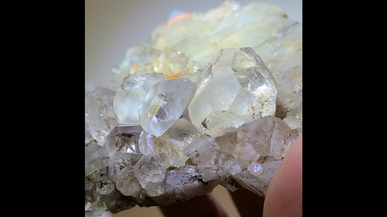 Colorless fluorite cluster in dodecahedron shapes with amazing rainbows ...