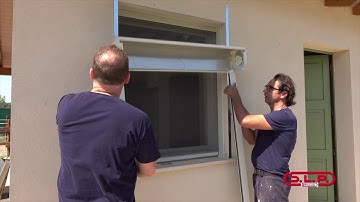 S.L.P. snc: installation of a rolling shutter with central lever projection frame